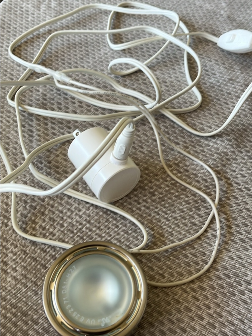 IKEA White puck light for in cabinet lighting. .